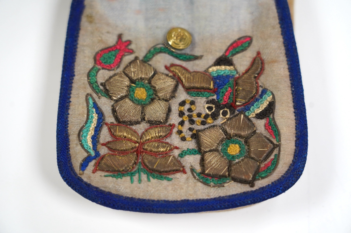 An Asian embroidered and metal thread purse, possibly Tibetan, 12 x 8cm. Condition - fair to good